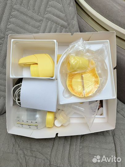 Молокоотсос medela электрический