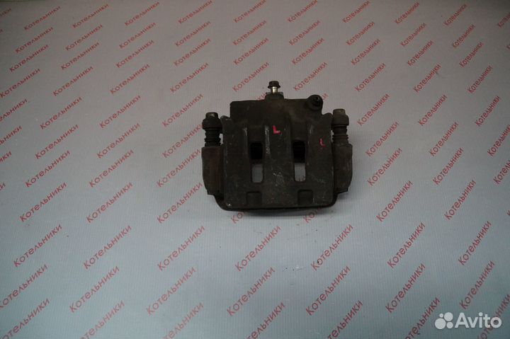 Nissan 41011-WF100 Суппорт тормозной левый