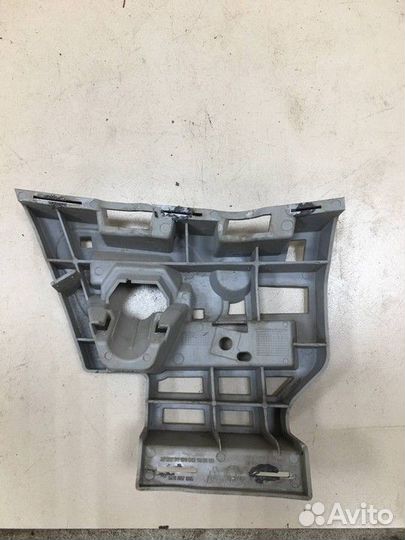 Кронштейн форсунки омывателя фар левый