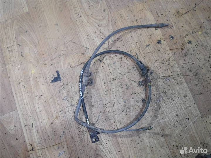 Трос стояночного тормоза Mitsubishi Carisma (DA)