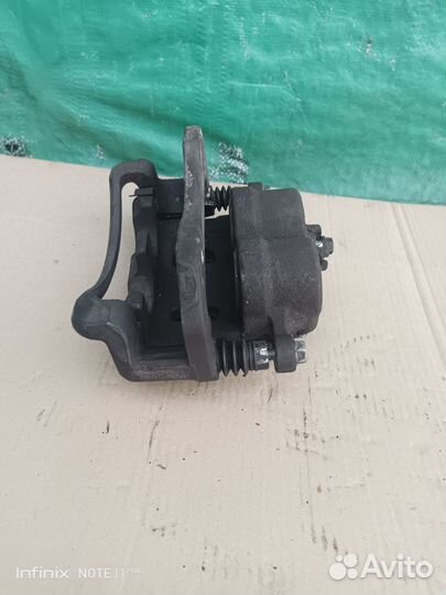 Суппорт тормозной передний правый Kyron 2009 г