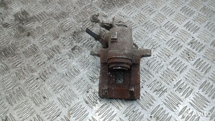 Суппорт тормозной задний левый Volkswagen Golf