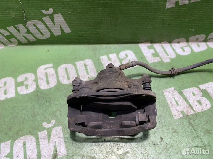 Суппорт тормозной передний правый Nissan March K11