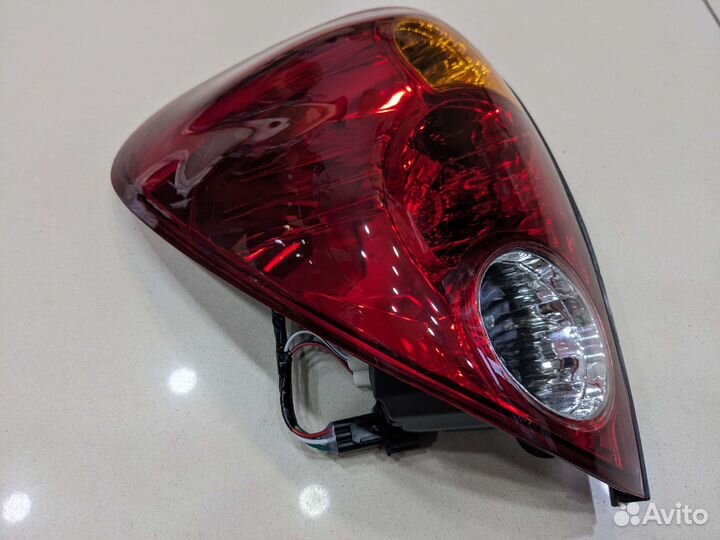 Фонарь задний левый mitsubishi L200 2006-2014