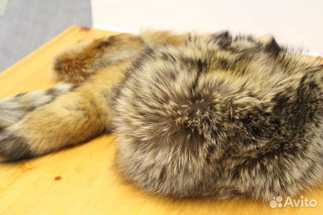 Теплая и комфортная шапка из енота