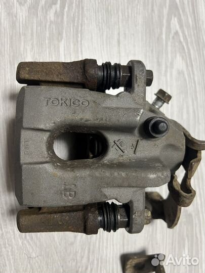 Суппорт задний левый правый Toyota Corolla E150