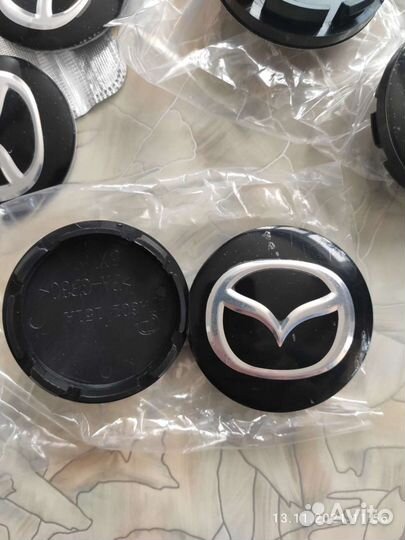 Колпачки и эмблемы Mazda
