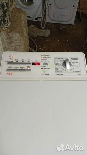 Стиральная машина AEG с вертикальной загрузкой