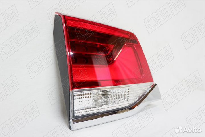 Фонарь левый задний в крышку багажника 560014