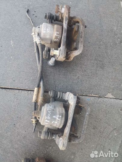 Суппорт задний левый правый Nissan X-Trail T31