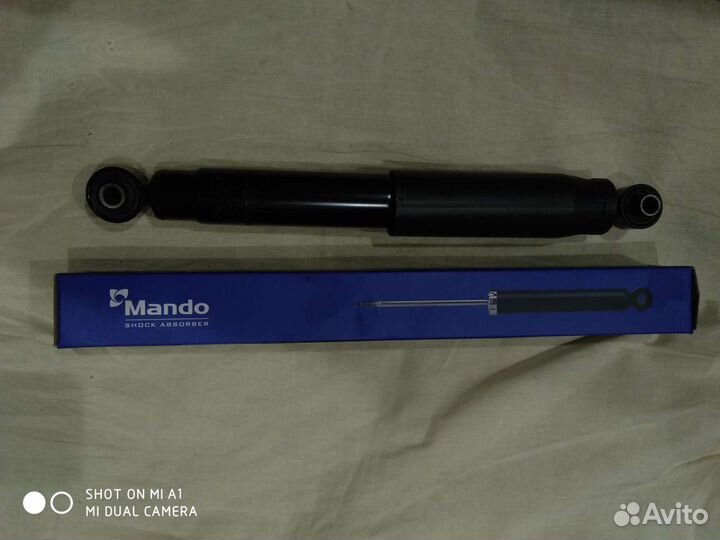 Амортизатор Mando для гранд старекс 553004H050