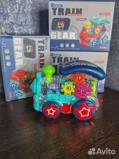 Прозрачный паровозик с шестеренками со световыми и
