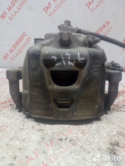 Суппорт тормозной передний левый Volkswagen Tiguan