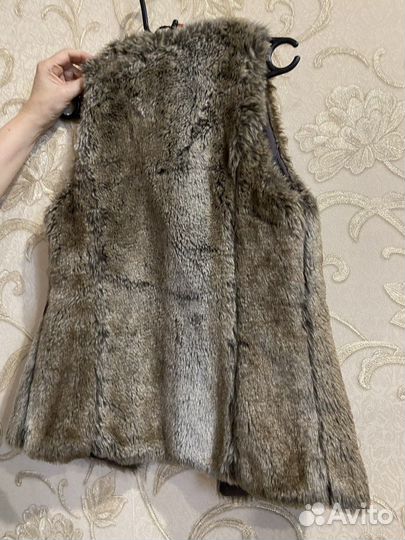 Жилетки меховые женские