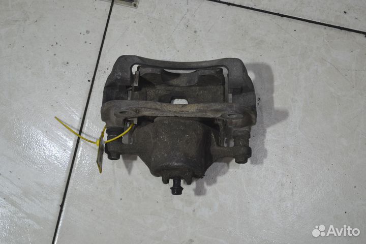 Тормозной суппорт передний левый Kia Rio 3