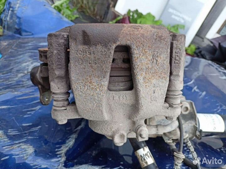 Суппорт тормозной передний левый Opel Corsa D