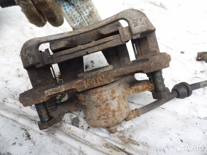 Суппорт тормозной передний левый Chevrolet Aveo (T