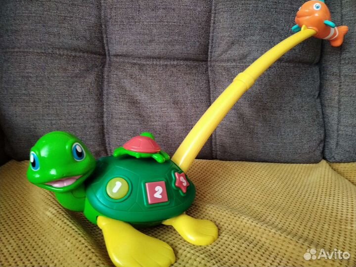 Игрушка каталка с ручкой