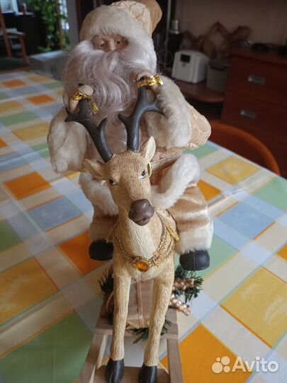 Дед мороз на олене музыкальная игрушка