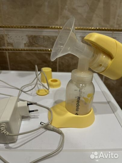 Молокоотсос medela электрический