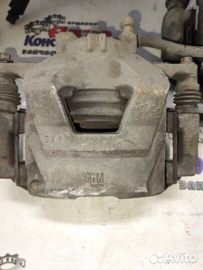 Суппорт тормозной передний левый Chevrolet Cruze