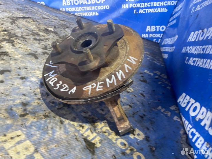 Задний левый поворотный кулак Mazda Familia седан