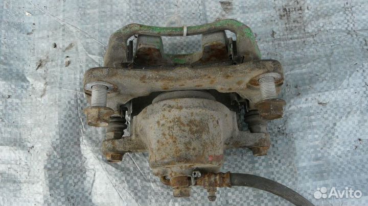 Суппорт тормозной пер левый Toyota Corolla IX