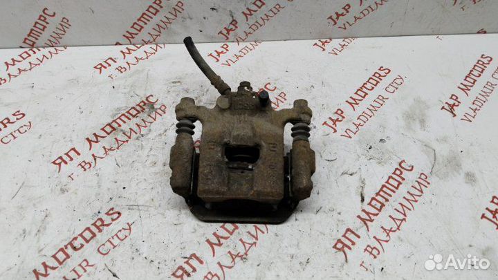 Суппорт тормозной задний левый Nissan Teana 2.5