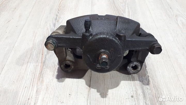 Суппорт тормозной перед Nissan X-trail T31 Лев