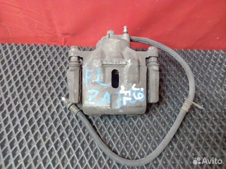 Суппорт передний левый Toyota Probox NCP51V 1NZ-FE