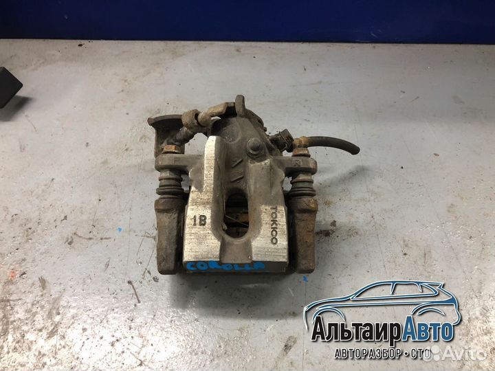 Тормозной суппорт задний правый Toyota Corolla 10