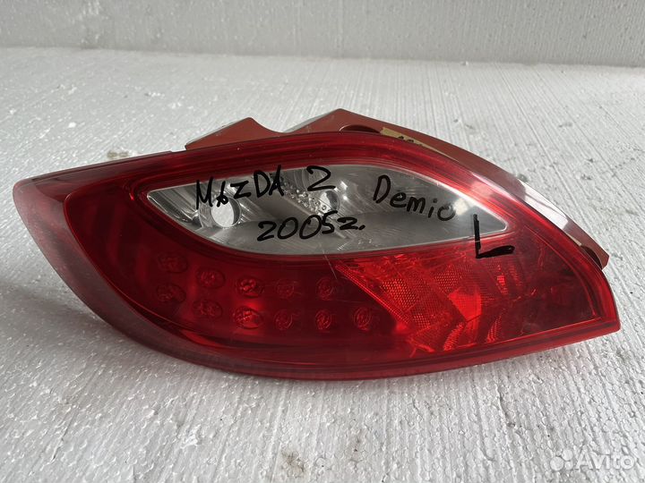 Фонарь задний левый mazda demio