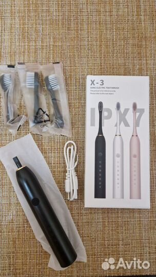 Электрическая зубная щетка