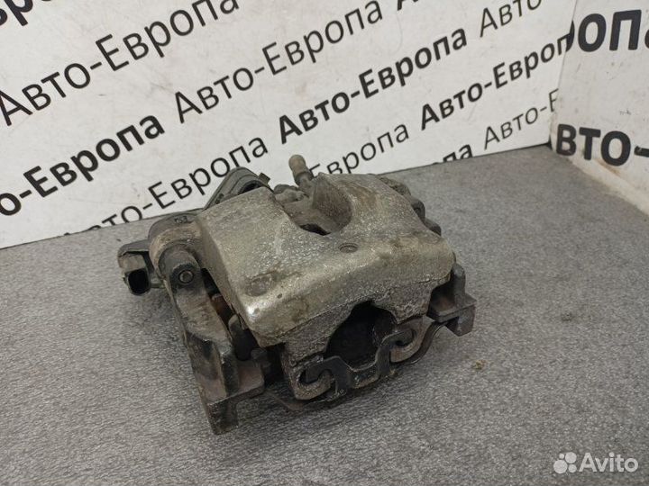 Суппорт с электроручником задний левый