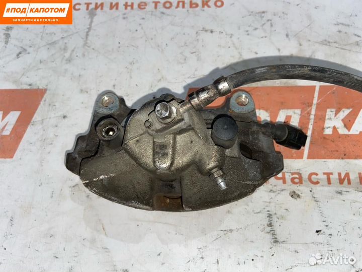 Суппорт тормозной передний левый Volkswagen Caddy