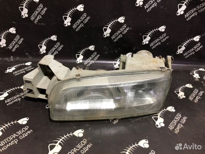 Фара передняя левая Mazda 626 GE