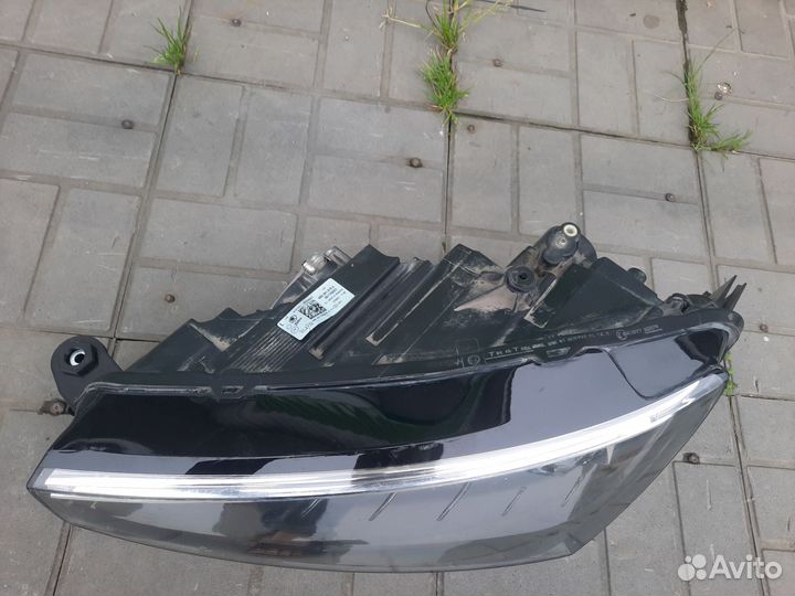 Фара левая Skoda Rapid
