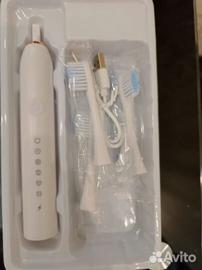 Электрическая зубная щетка
