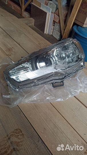 Фара левая оригинал Лансер 10
