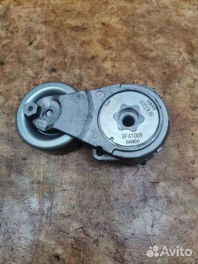 Натяжитель ремня генератора Nissan Qashqai J10