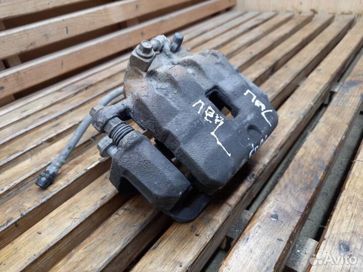 Суппорт тормозной передний левый Opel Astra J 2012