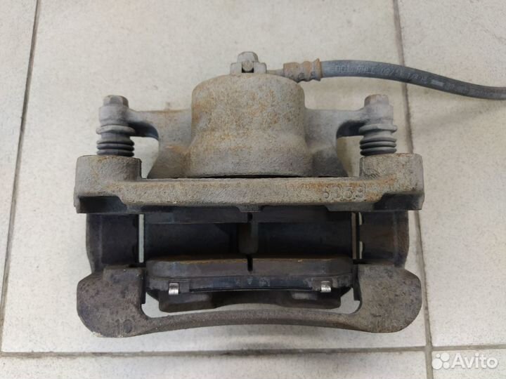 Тормозной суппорт передний правый Ниссан Кашкай