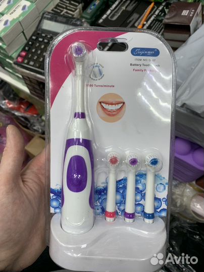 Электрическая зубная щетка