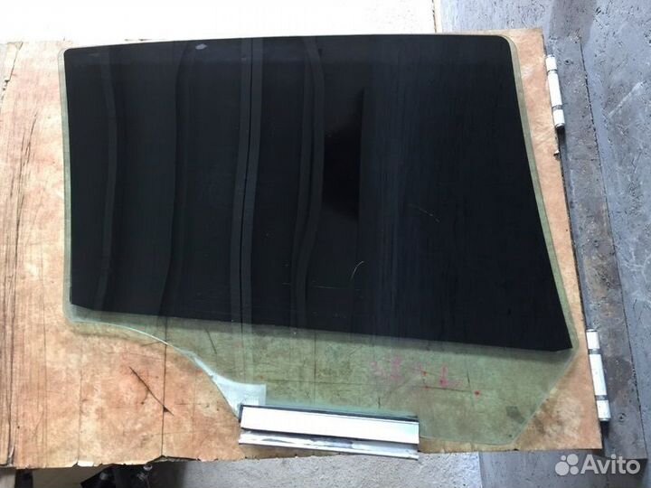 Стекло задней левой двери Опель Астра Н