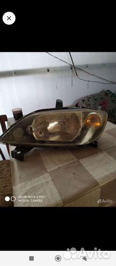 Фара Mazda Demio L