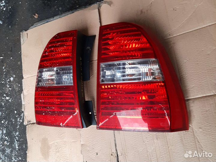 Фонарь Левый Киа Спортейдж 2 оригинал дорестал