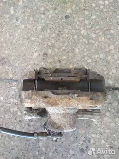 Суппорт тормозной передний Поло Седан