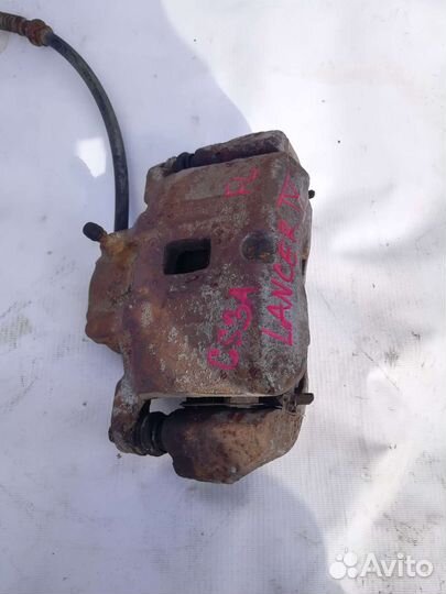 Суппорт тормозной передний Mitsubishi Lancer 9