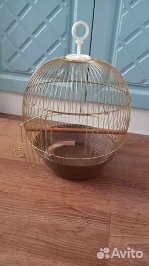 Клетка для попугая и корма для пернатых