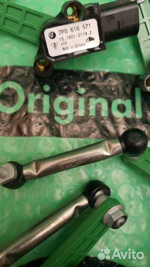 Датчик уровня кузова 7p0616571 VAG Оригинал Новый